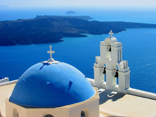 Postcard Worthy shot of Santorini's Blue Domes showing the mouth of the Santorin Volcano from the island Nea Kameni