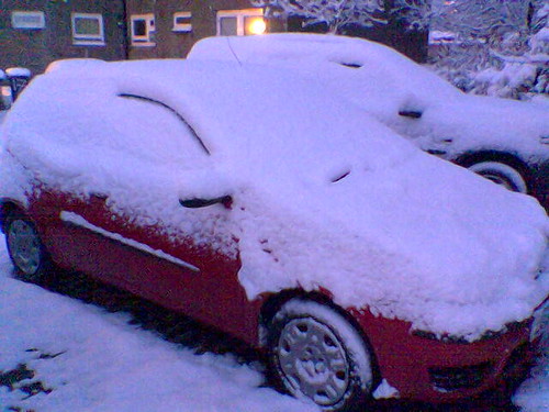 Snow fall in Cumbernauld; Fiat Punto covered in snow